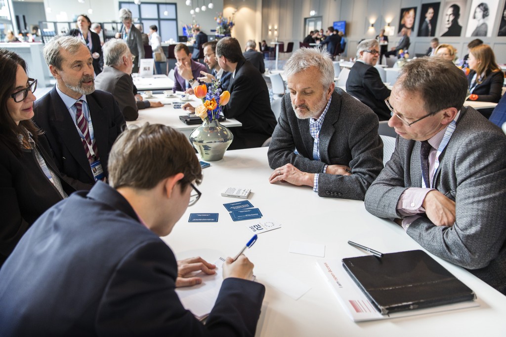 Some very recognisable conference delegates discussing TDM at the FutureTDM Open Science cafe. Image CC BY NL2016EU